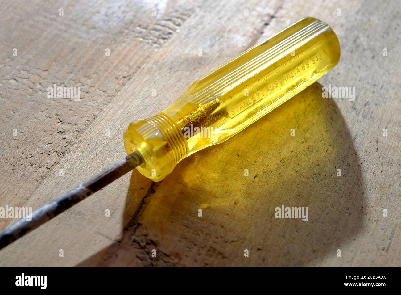 translucent yellow handle on old screwdriver Stock Photo Alamy