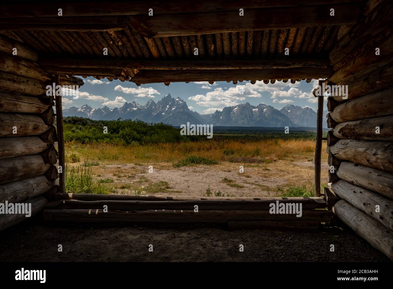 The Grand Teton mountain range near Jackson Hole, Wyoming as seen from the historic homestead site of Cunningham Cabin. Stock Photo