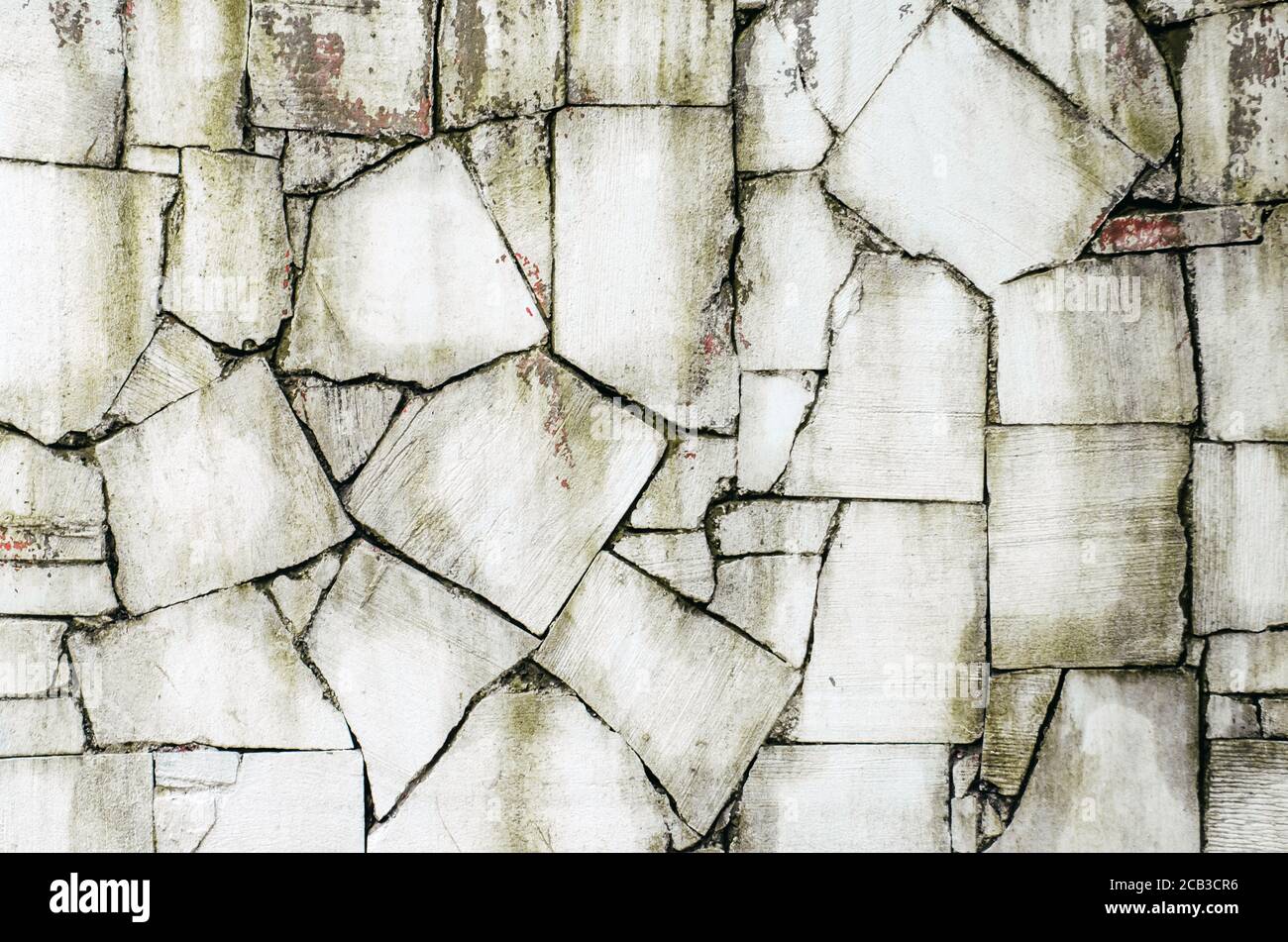 Old gray stone wall with green moss texture background Stock Photo - Alamy
