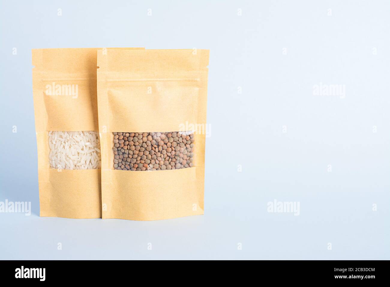 Two paper bags with rice and lentils Stock Photo