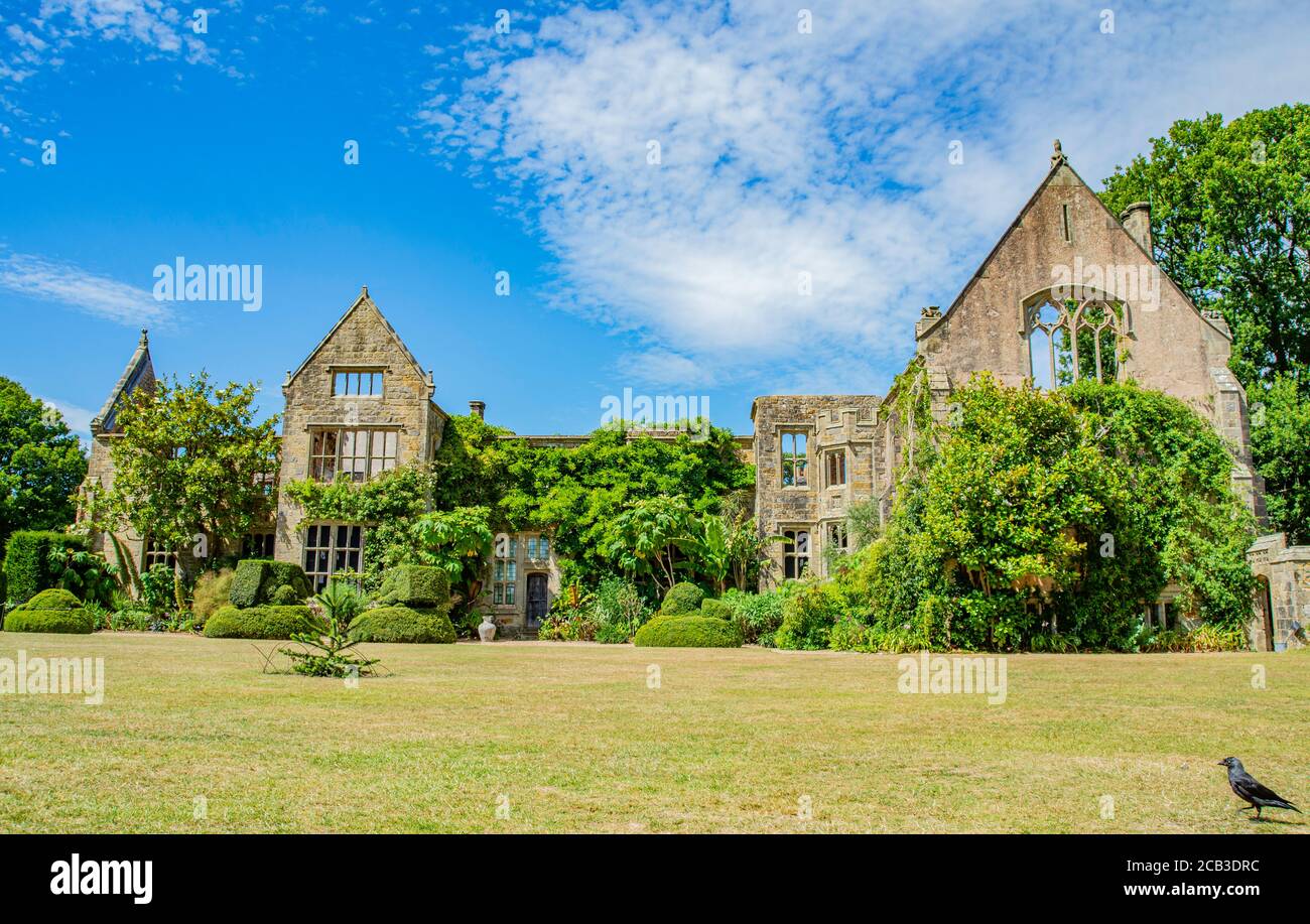 The ruins of Nymans house with trees in front of the house on a summer's day. Haywards Heath, West Sussex, England. Stock Photo