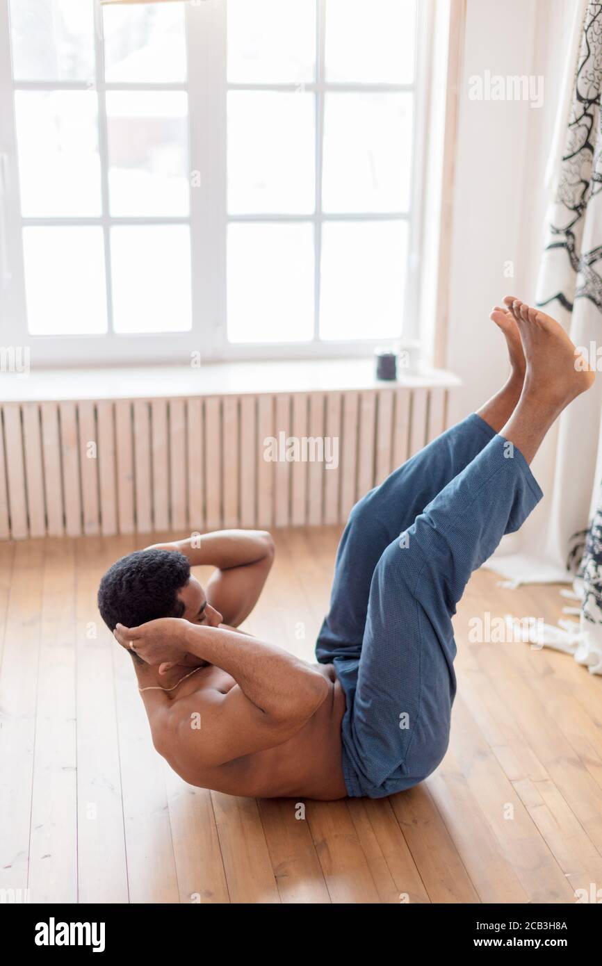 hardworking sportsman takes care of his body, man keeping fit. side view full length photo Stock Photo