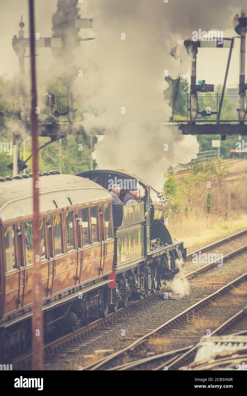 Vintage UK steam train leaving Kiddeminster station on the Severn Valley Railway heritage line, summer 2020, as heritage railways open after lockdown. Stock Photo