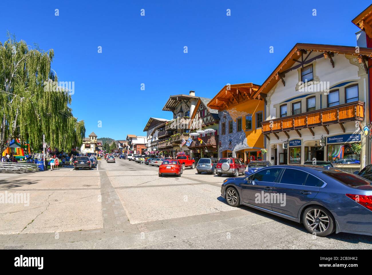 Cars and tourists fill the main street through the Bavarian themed town of Leavenworth, Washington, United States. Stock Photo