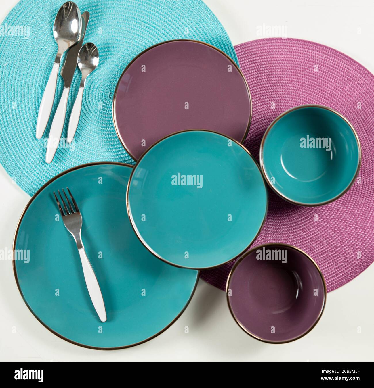 Top view of bright colorful kitchen plates and utensils Stock Photo Alamy