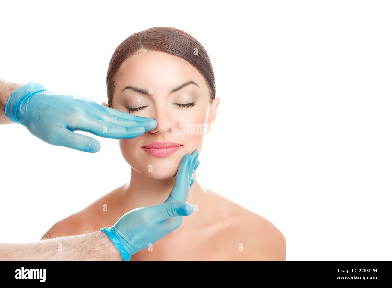 Woman is preparing to have nose surgery done, isolated cutout on white