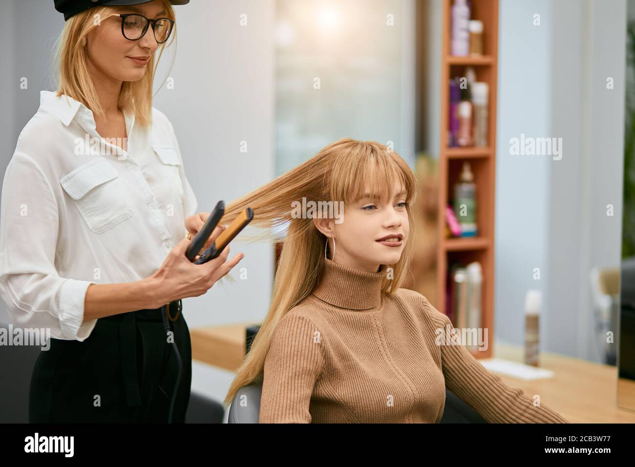 Beauty concept. professional hairdresser or hairdo doing her daily work