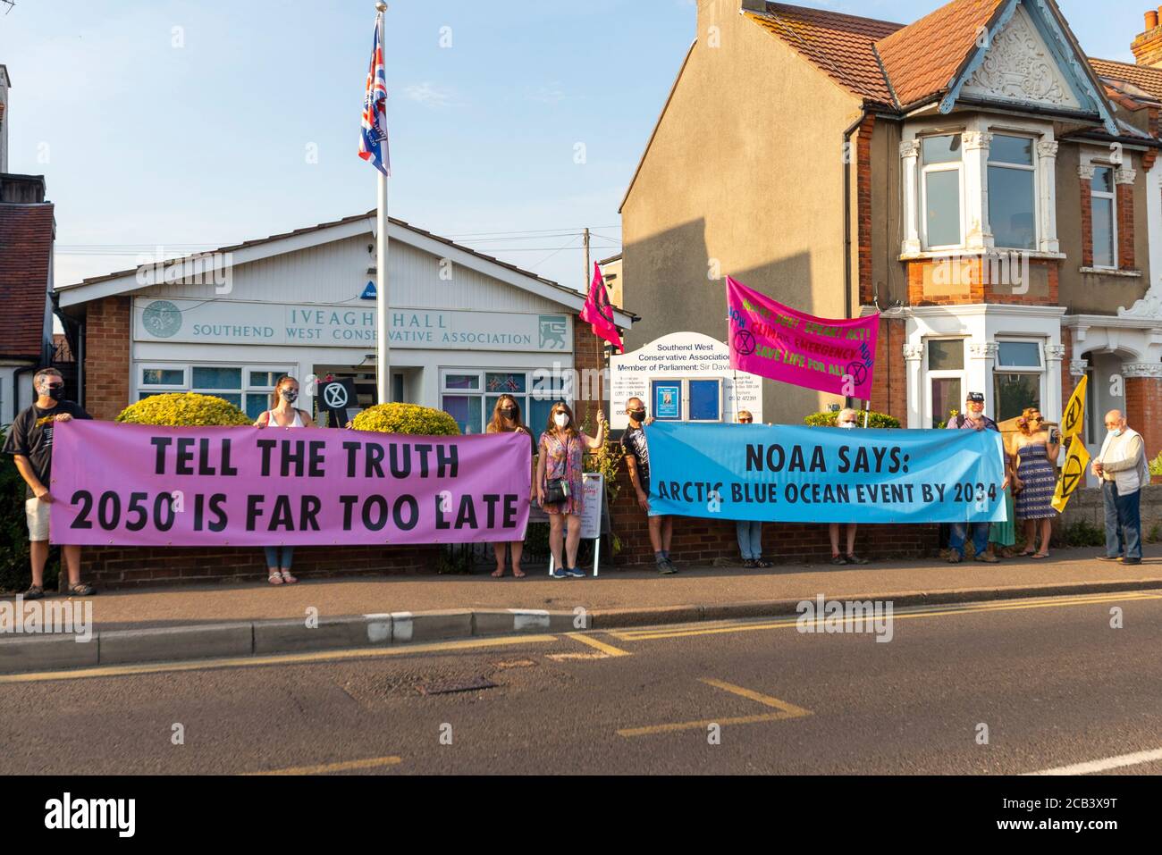 Leigh Road, Leigh on Sea, Essex, UK. 10th Aug, 2020. The Southend branch of Extinction Rebellion held a protest outside the Iveagh Hall constituency office of David Amess, Conservative MP for Southend West. The climate change protesters held a banner stating 'Tell the Truth' in relation to the UK's target of reaching net zero emissions by 2050, which they believe is too late. NOAA have forecast a blue ocean event of melting arctic ice Stock Photo