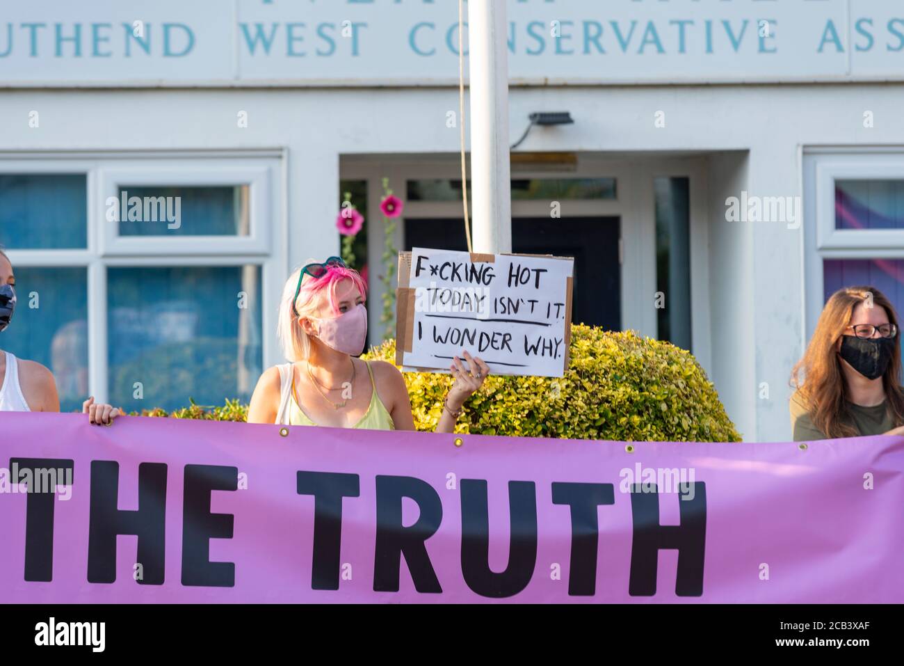 Leigh Road, Leigh on Sea, Essex, UK. 10th Aug, 2020. The Southend branch of Extinction Rebellion held a protest outside the Iveagh Hall constituency office of David Amess, Conservative MP for Southend West. The climate change protesters held a banner stating 'Tell the Truth' in relation to the UK's target of reaching net zero emissions by 2050, which they believe is too late. NOAA have forecast a blue ocean event of melting arctic ice Stock Photo