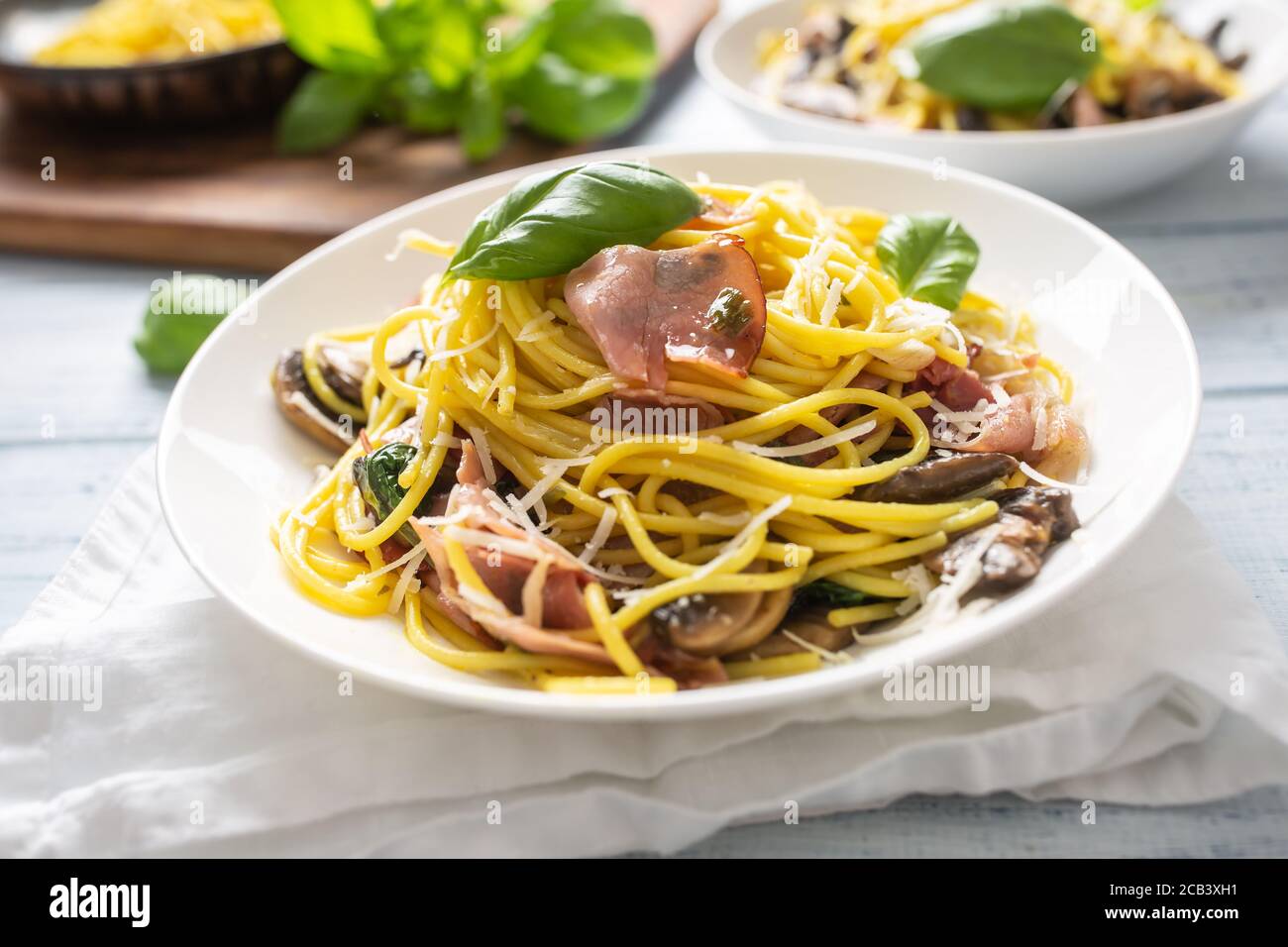Italian pasta spaghetti prosciutto mushrooms parmesan and olive oil