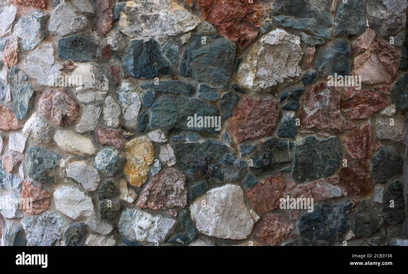 Colored stone wall. Design style wall decor Stock Photo Alamy