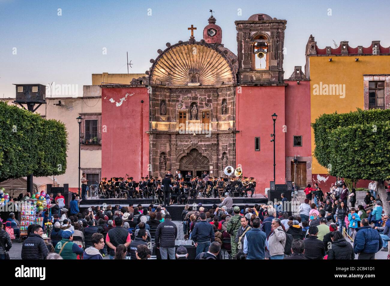 A city sponsored concert in the Plaza Civic in front of the Our Lady of Health church in the historic center of San Miguel de Allende, Guanajuato, Mexico. Stock Photo