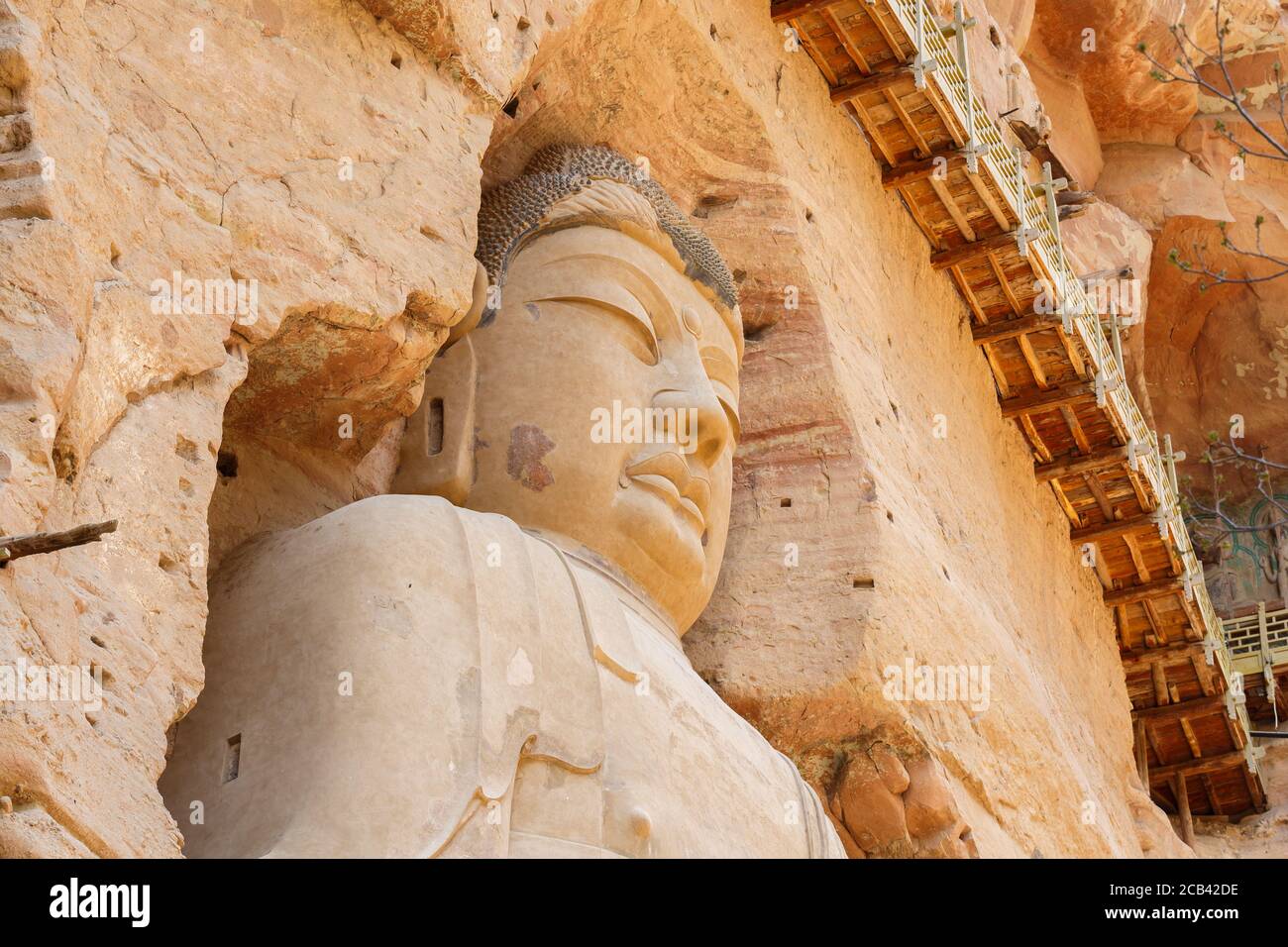 Close up of great buddha statue at the Bingling grottoes. Part of the Silk Road UNESCO World Heritage. Stock Photo