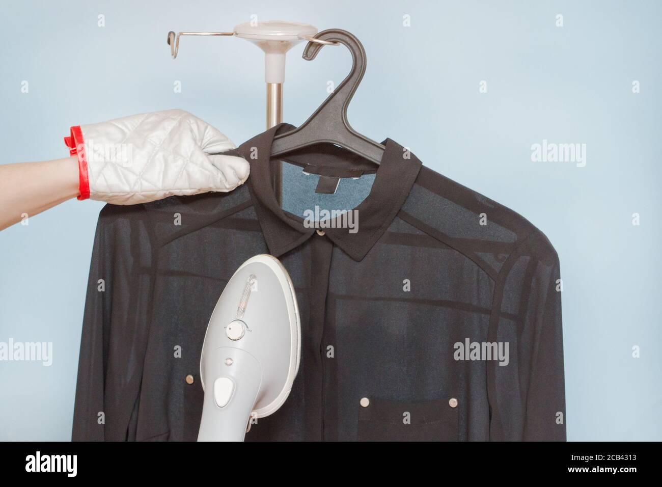 Process of steaming a shirt, closeup Stock Photo Alamy
