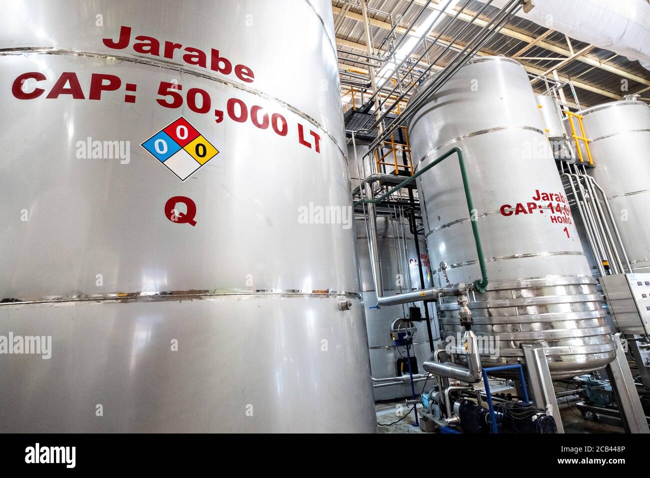 Giant vats containing maguey syrup, part of the extraction system at