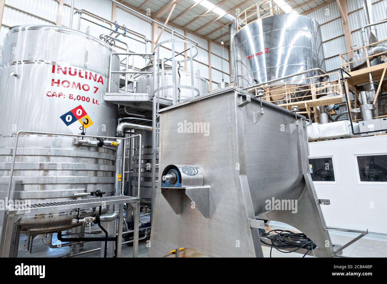 Giant vats containing maguey syrup, part of the extraction system at