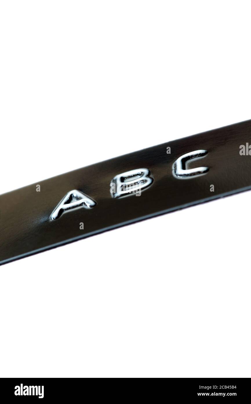 Black embossed label tape spelling out the letters A B C in capital