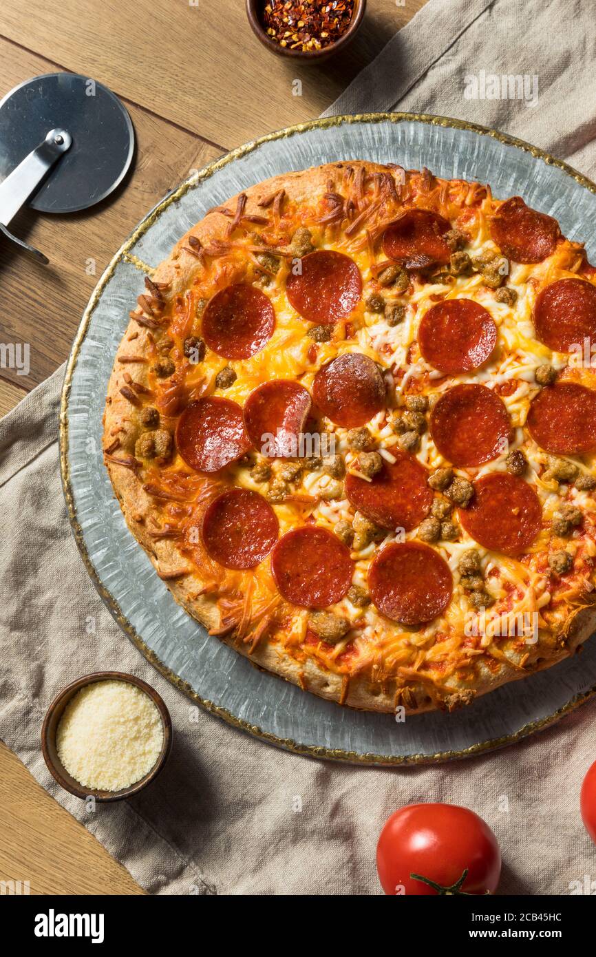 Homemade Meat Lovers Pepperoni Pizza with Sausage and Bacon Stock Photo Alamy