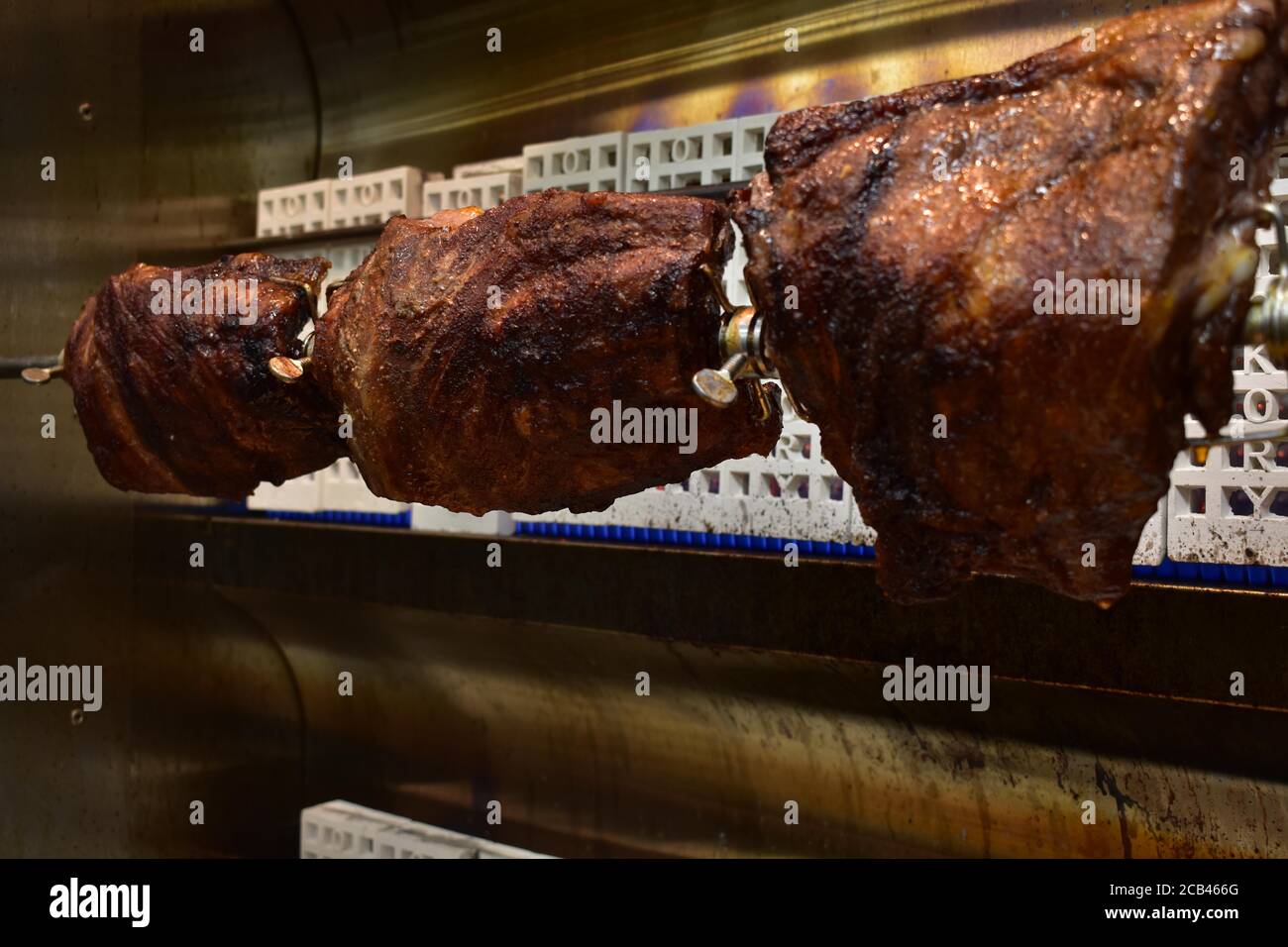 Three Well-Done Racks of Ribs Inside a Rotisserie Stock Photo - Alamy