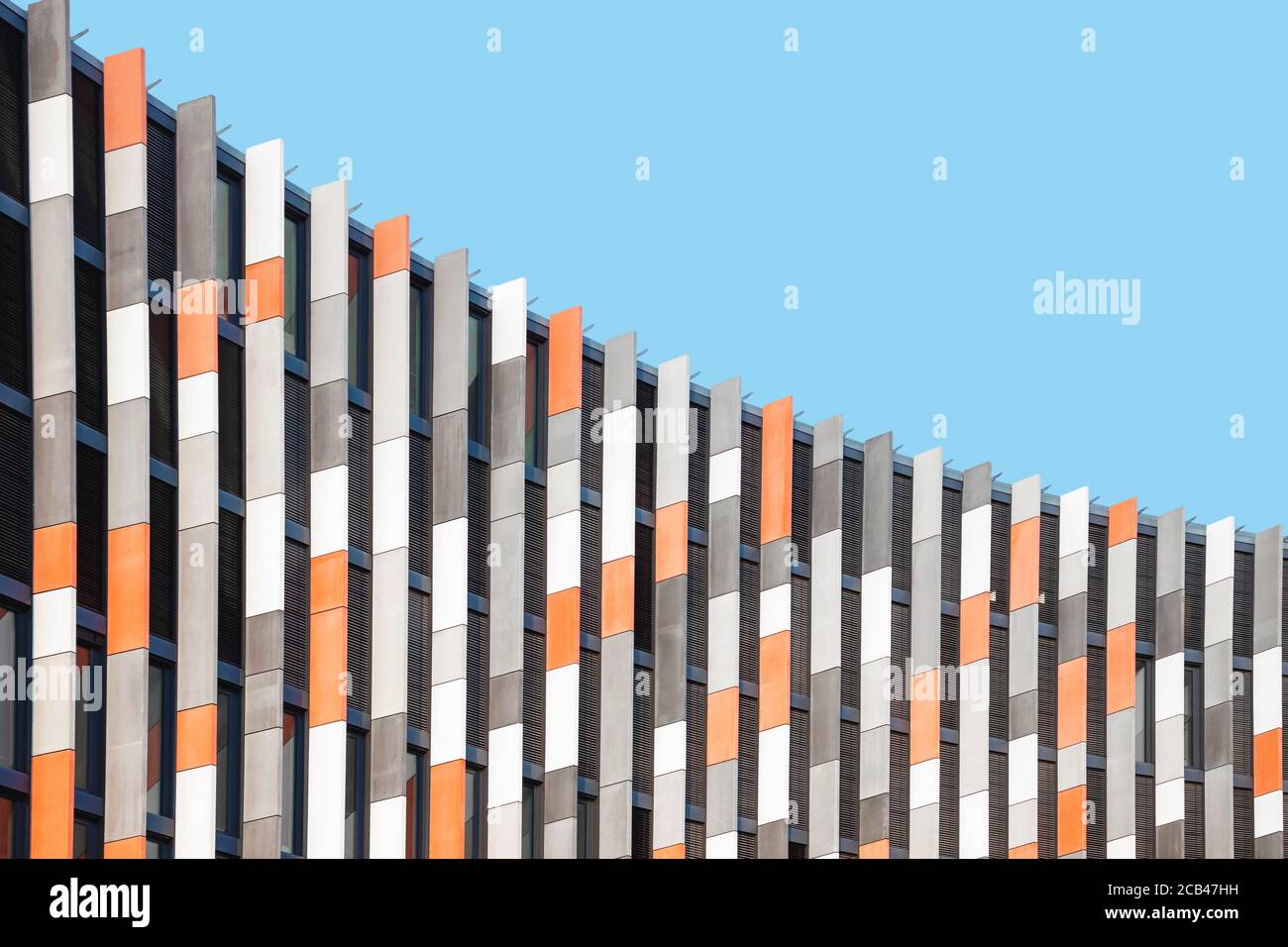 Colorful detail of modern building facade against blue sky. Abstract geometric architectural background Stock Photo
