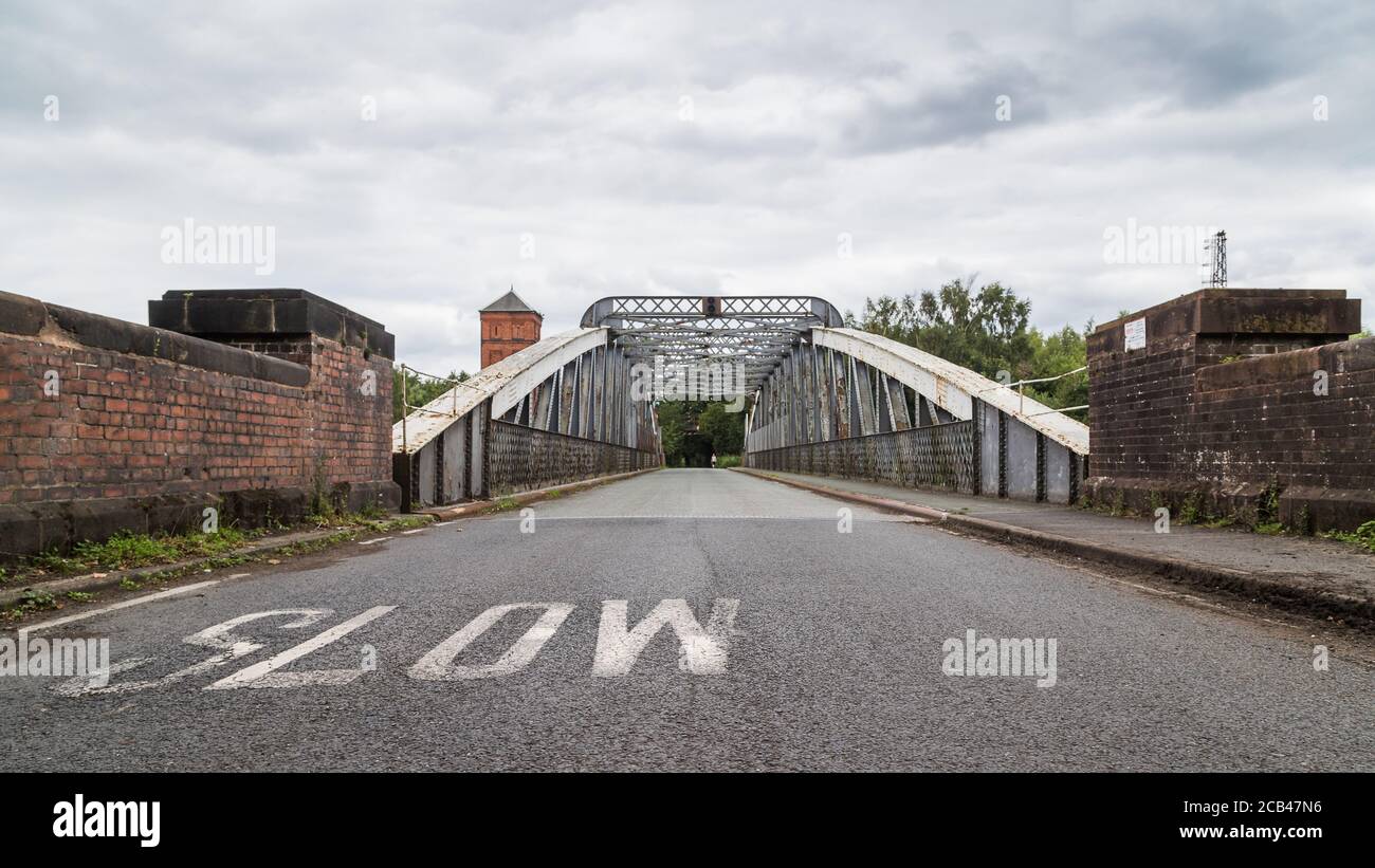 Looking over the Moore Lane swing bridge which spans the Manchester Ship Canal in Cheshire. Stock Photo