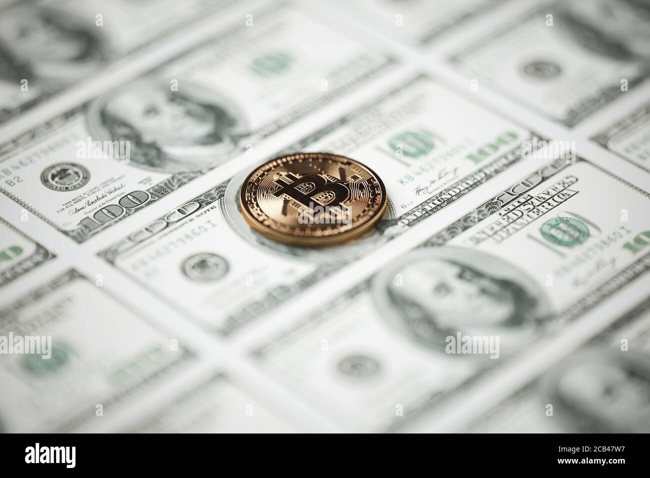 One Bitcoin on hundred dollars bills. Closeup dof, macro shot. 3d rendering illustration Stock Photo