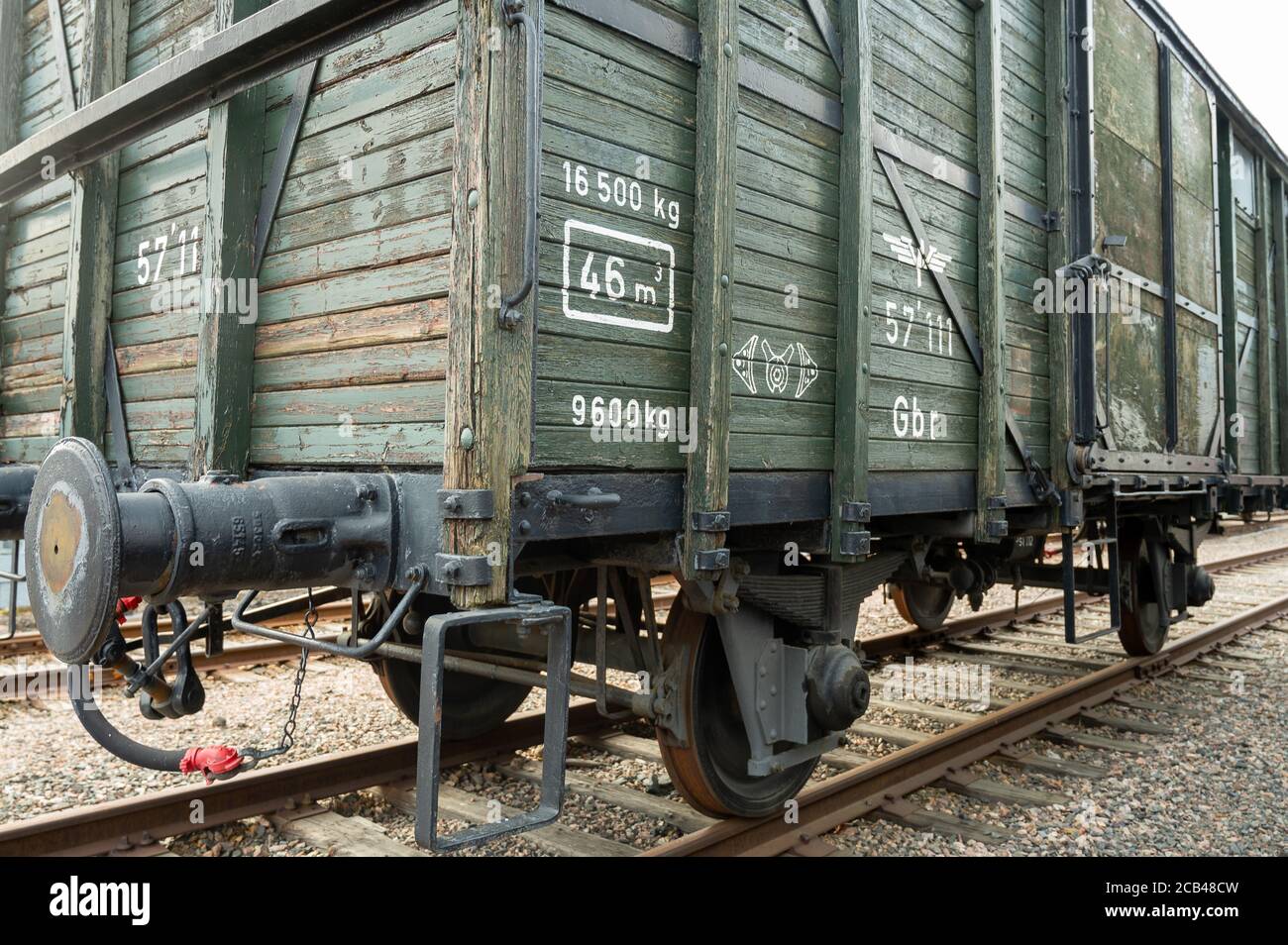 A closeup of a vintage wooden railroad car standing on the track Stock Photo