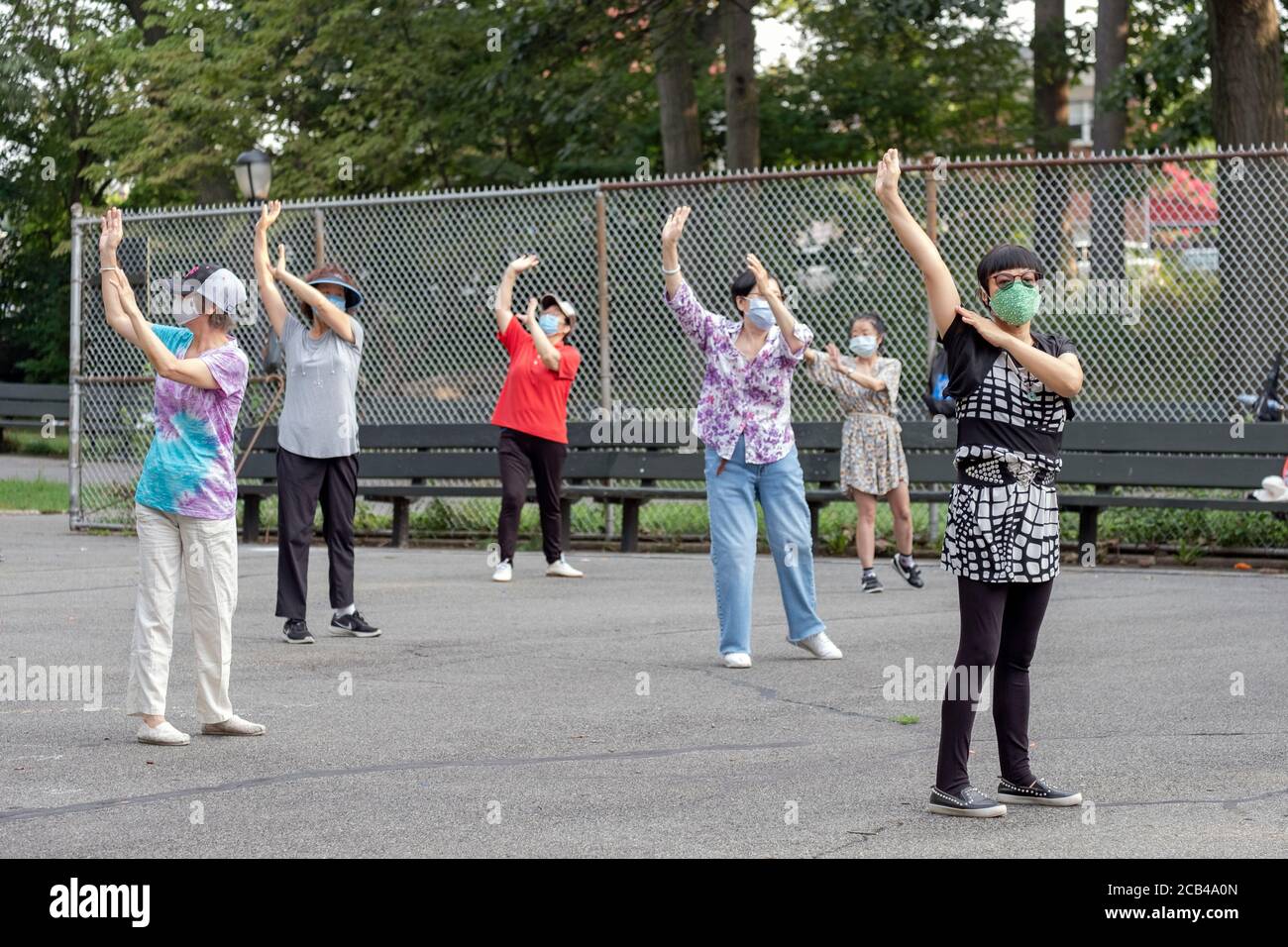 Women of various ages and ethnicities attend a morning Tai Chi class