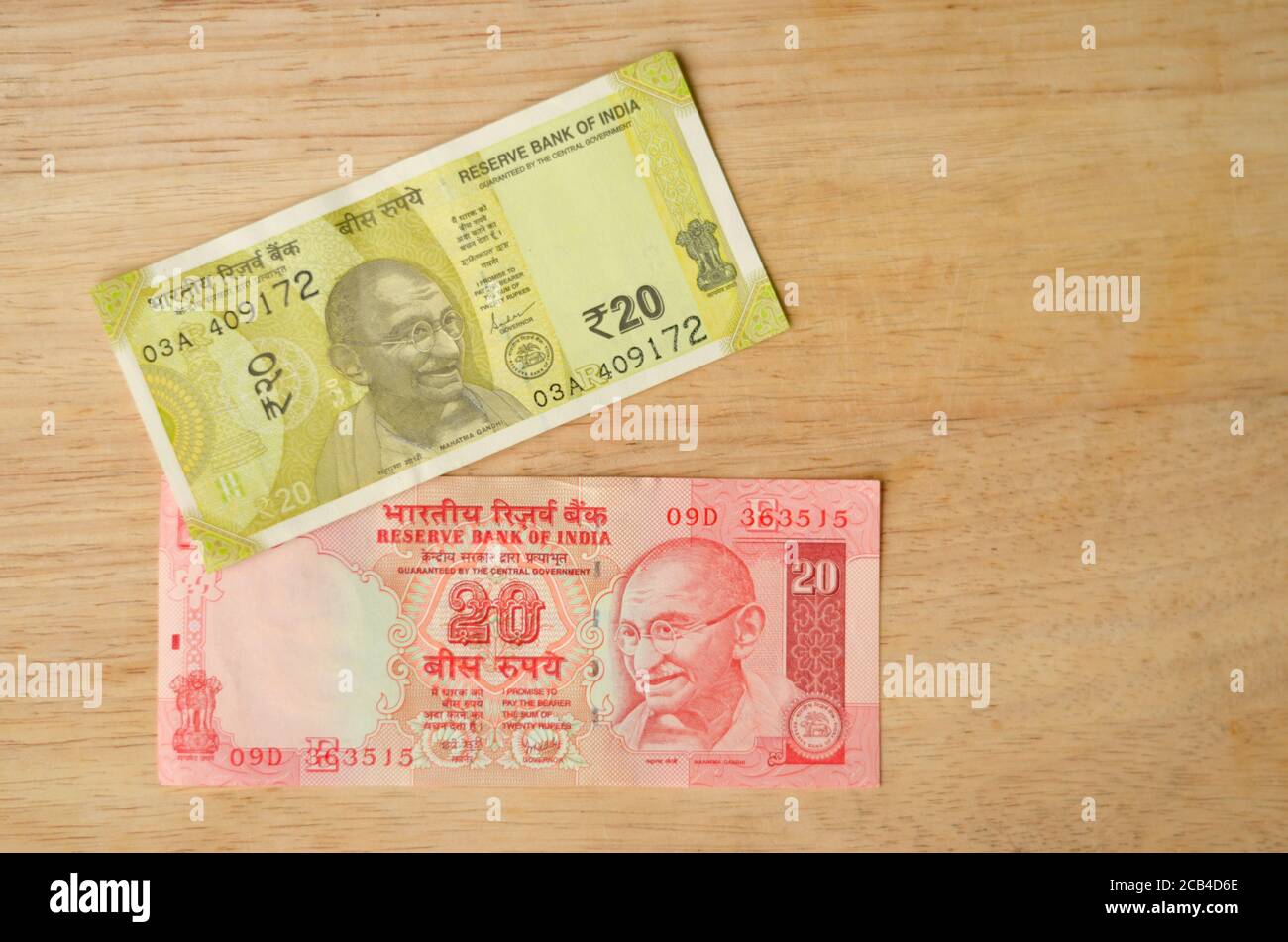 Old red and new yellow 20 denomination Indian Rupees Currency note after demonetisation Stock Photo