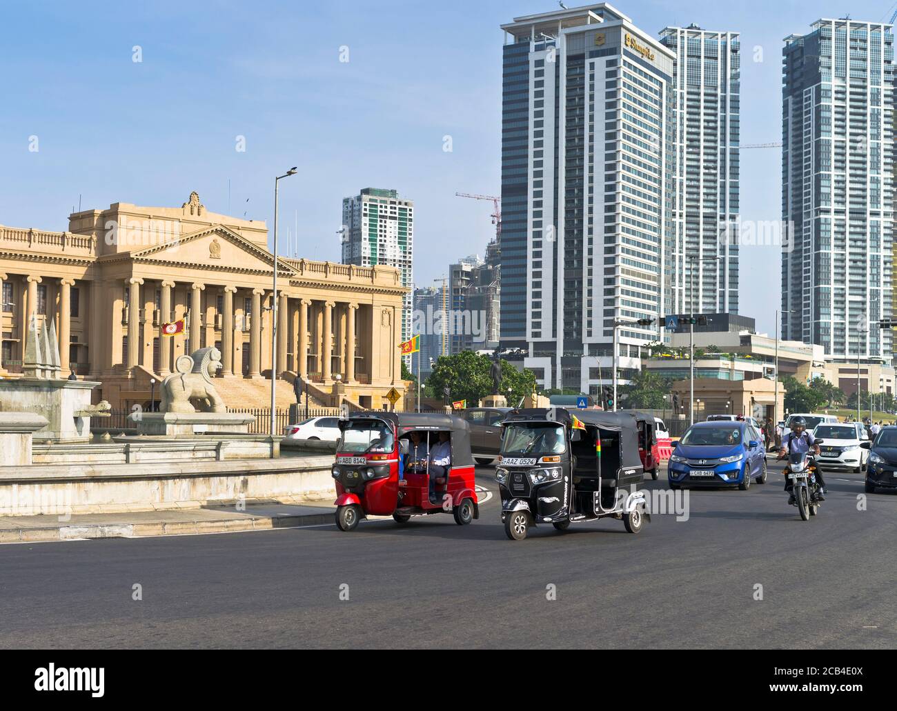 dh Galle Face roundabout COLOMBO CITY SRI LANKA Cars Tuk Tuk taxis traffic Old Parliament Building Stock Photo