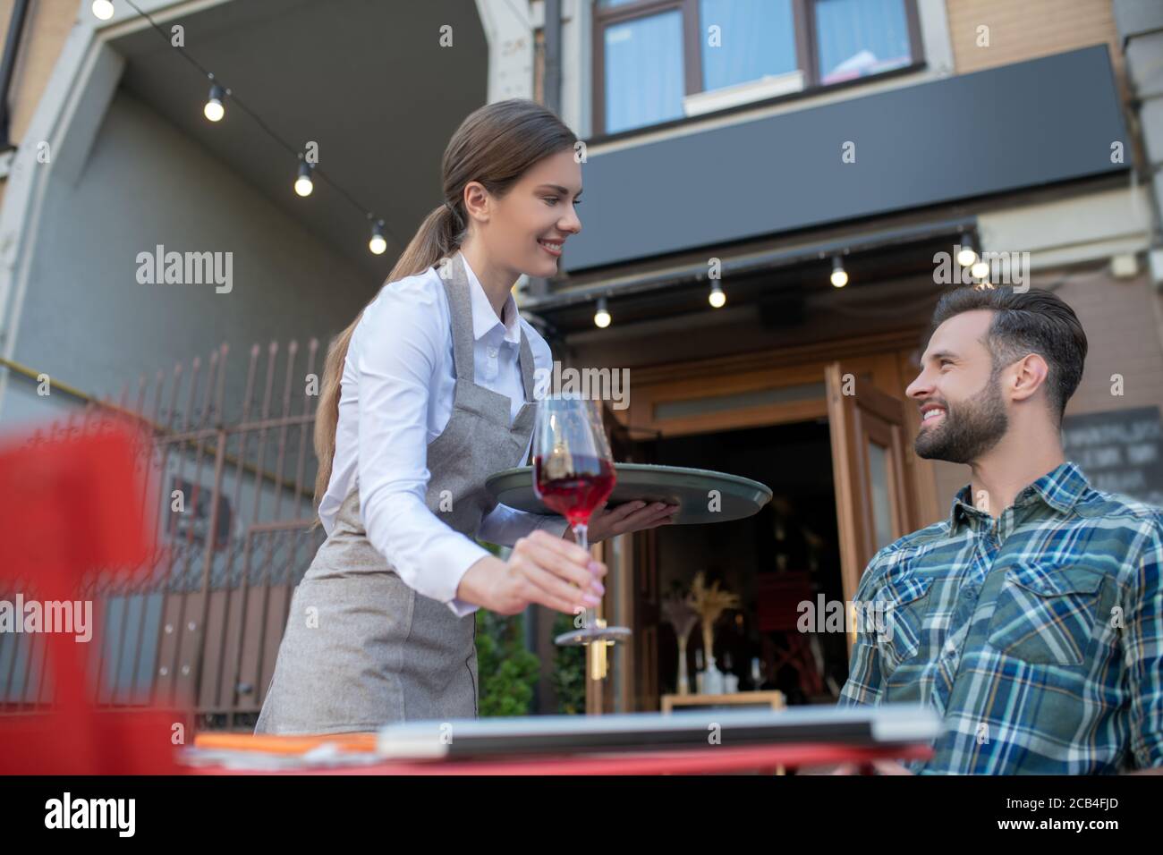 Waitressing Man Bearded man woman tray hi-res stock photography and images - Alamy