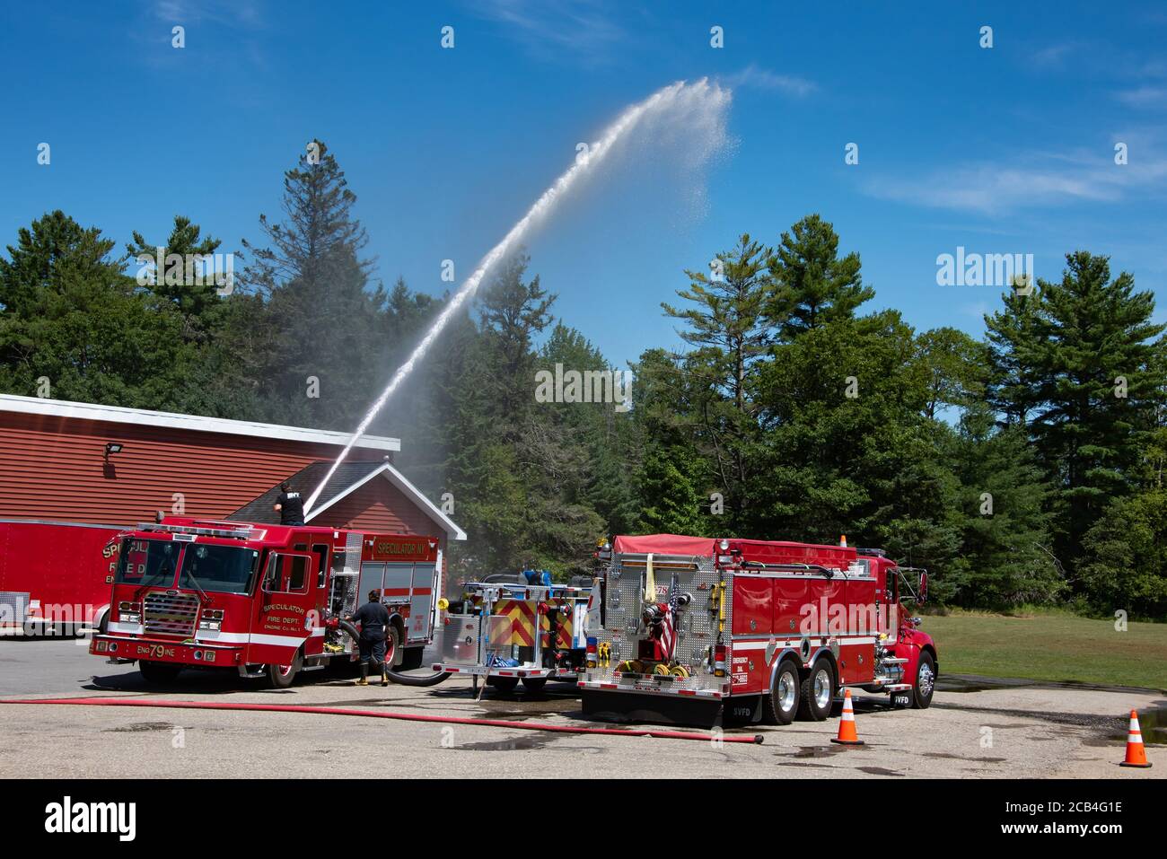 Red fire truck blowing water in a building during daytime photo – Free  Truck Image on Unsplash