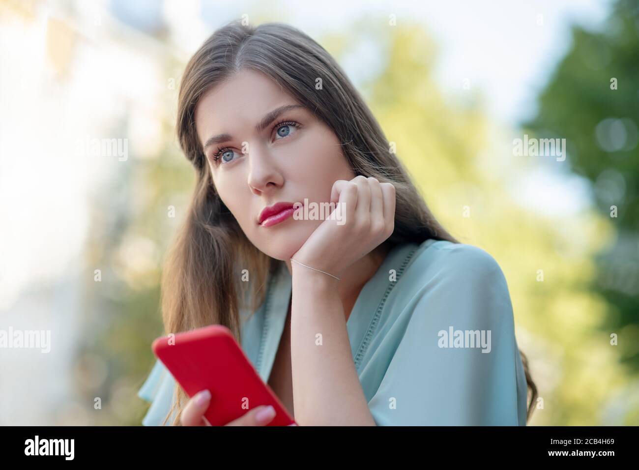 Female resting chin on hand hi-res stock photography and images - Alamy
