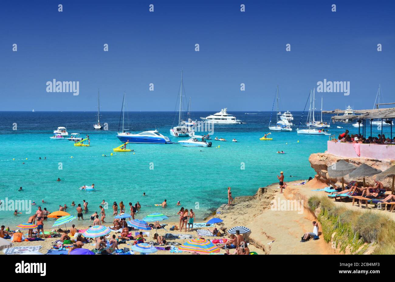 SPAIN JULY 13, 2017 Tourists relax on Cala Comte, famous