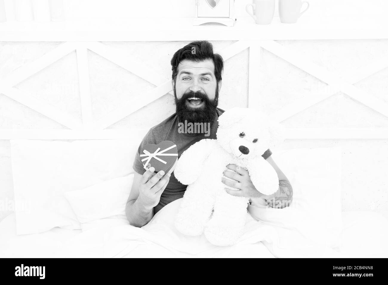 Shopaholic. Valentines day morning. my birthday. Happy adulthood. home shopping concept. Love and happiness. bearded man teddy bear in bed. Gift box for holidays. nice present for you. Stock Photo