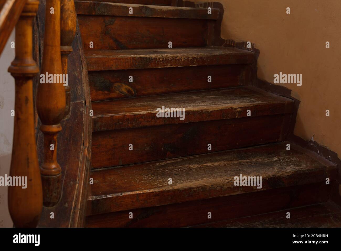 Shabby steps of old wooden staircase with selective focus Stock Photo
