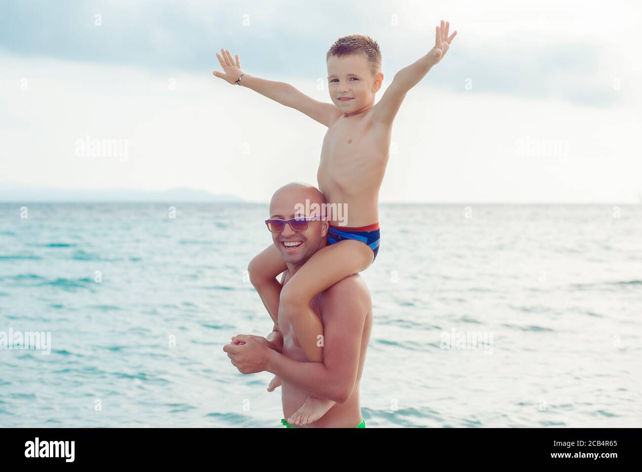 father and son playing in water having a great time Stock Photo