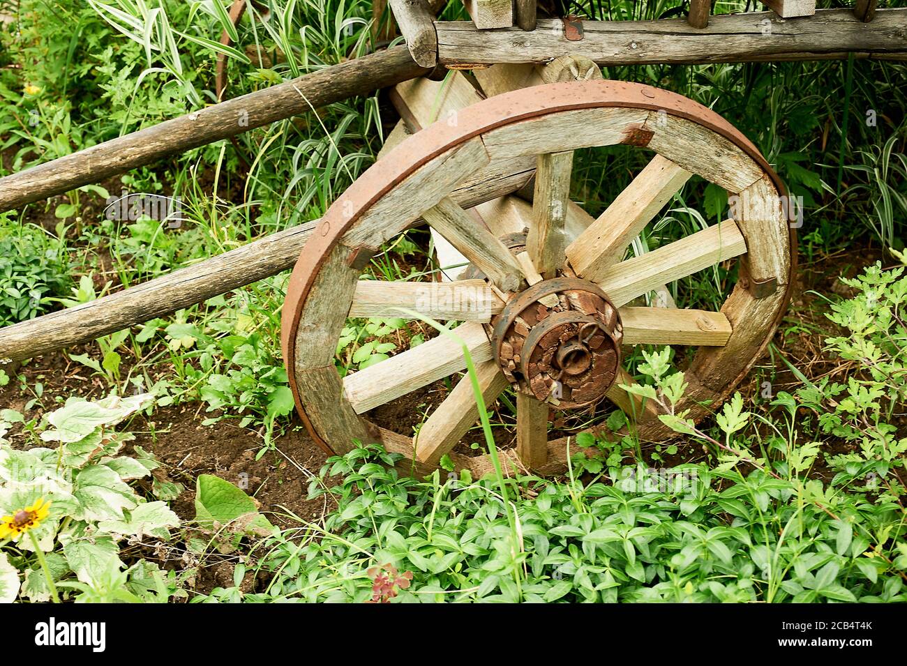 An old wooden wheel. Part of the cart. An ancient means of movement