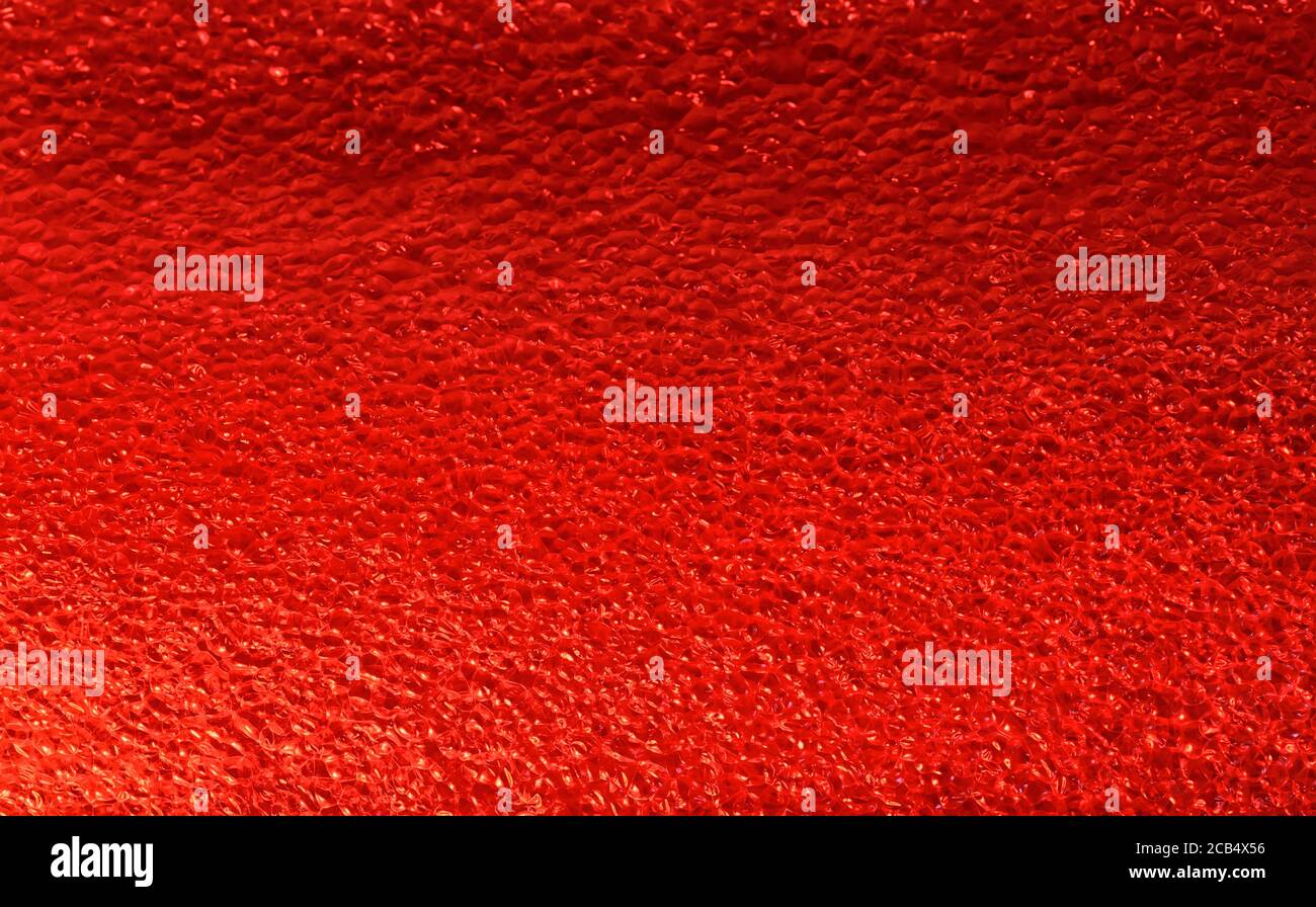 Red plastic foam and bubbles background Stock Photo