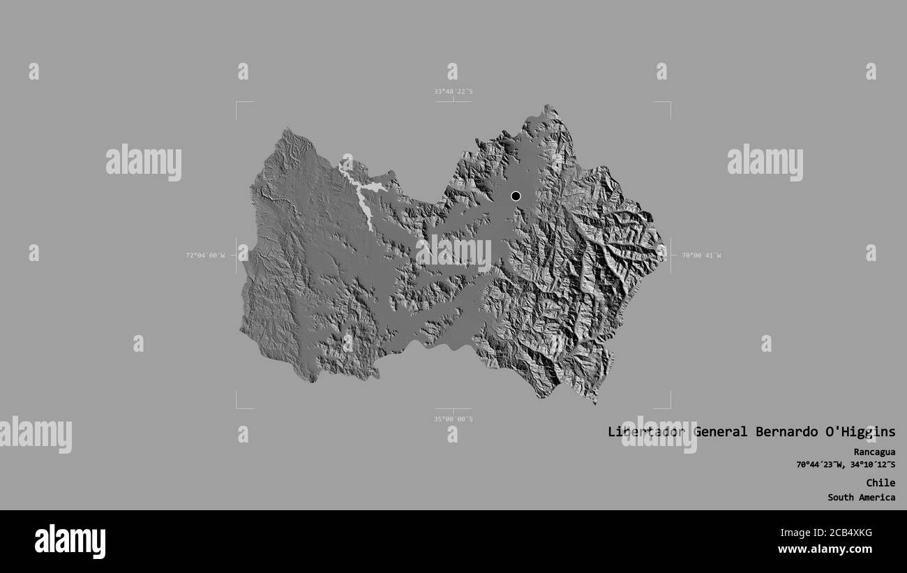 Area of Libertador General Bernardo O'Higgins, region of Chile, isolated on a solid background in a georeferenced bounding box. Labels. Bilevel elevat Stock Photo