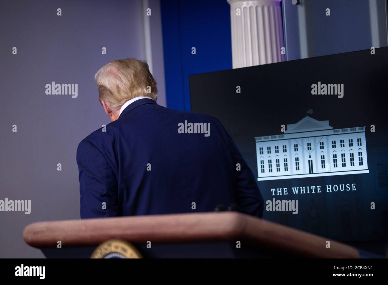Washington, United States Of America. 10th Aug, 2020. United States President Donald J. Trump is removed from the White House Briefing Room by a US Secret Service agent during a press conference in Washington, DC on Monday, August 10, 2020.Credit: Stefani Reynolds/Pool via CNP | usage worldwide Credit: dpa/Alamy Live News Stock Photo
