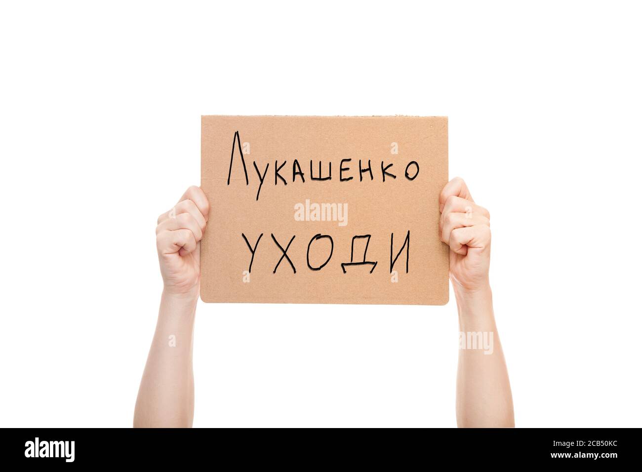 protest poster in hands with text Lukashenka go away, protester's hands with cardboard in hands isolated on white background. Stock Photo