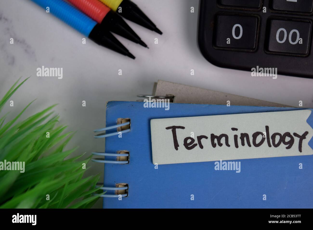 Terminology write on sticky notes isolated on office desk. Stock Photo