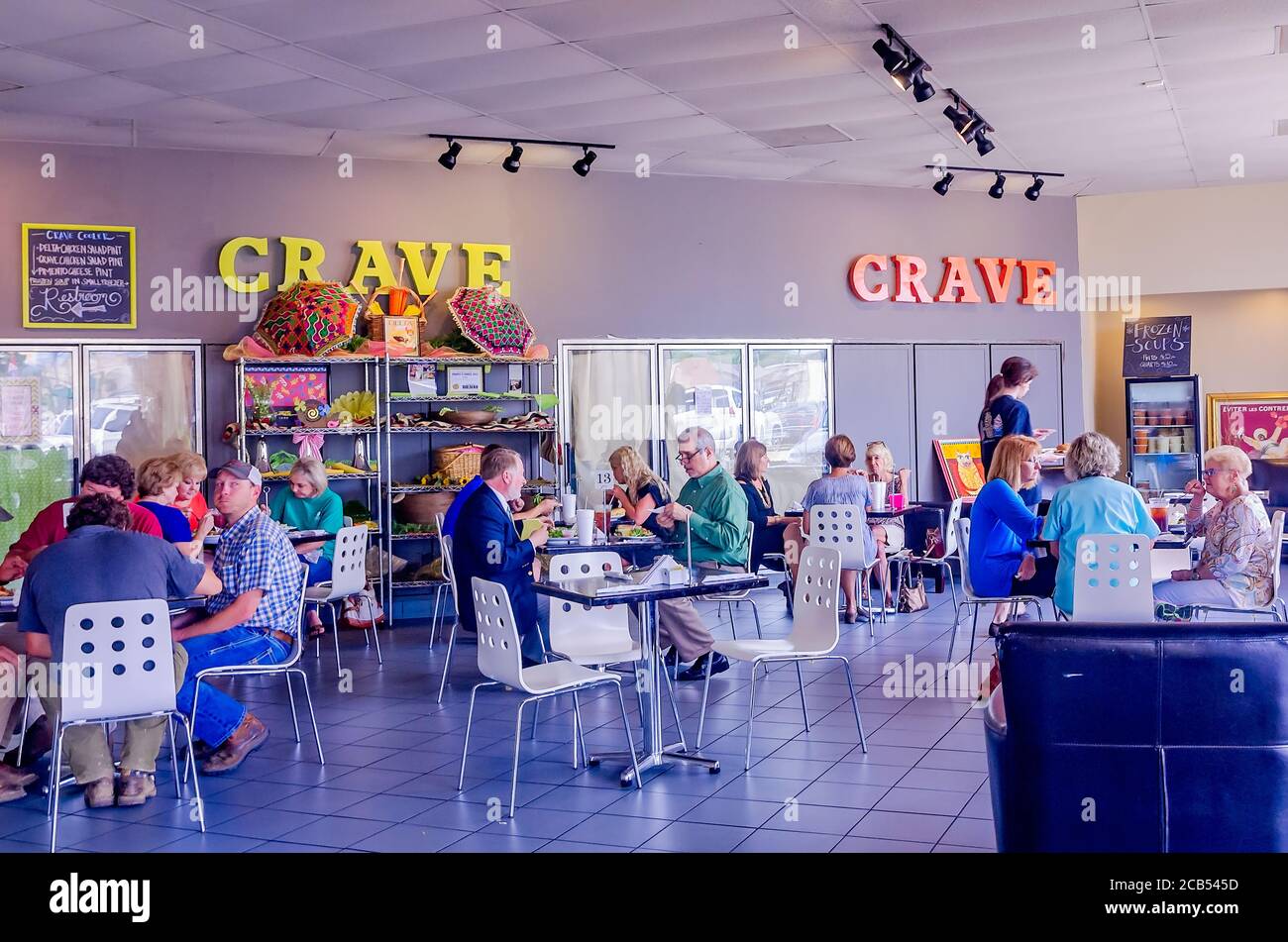 People eat lunch at Crave Bistro/Cupcakery, Aug. 12, 2016, in Cleveland, Mississippi. The bakery specializes in giant gourmet cupcakes. Stock Photo