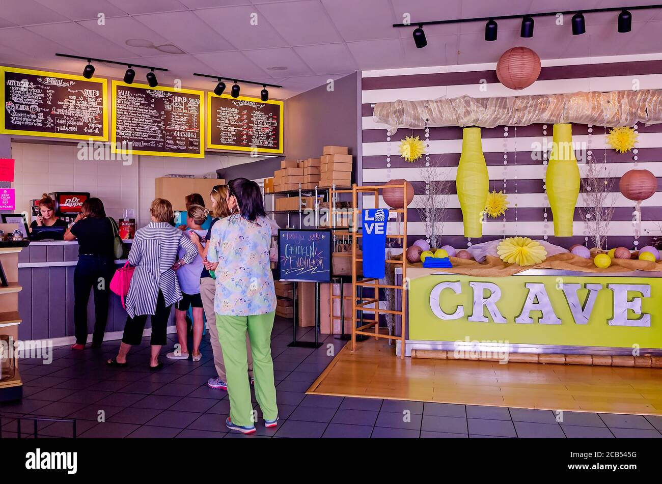 People line up for lunch at Crave Bistro/Cupcakery, Aug. 12, 2016, in Cleveland, Mississippi. The bakery specializes in giant gourmet cupcakes. Stock Photo