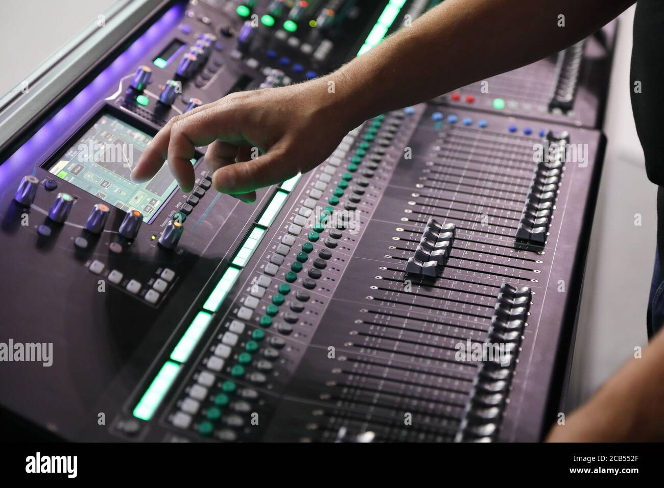Working with modern digital sound mixing console. Selective focus. Stock Photo