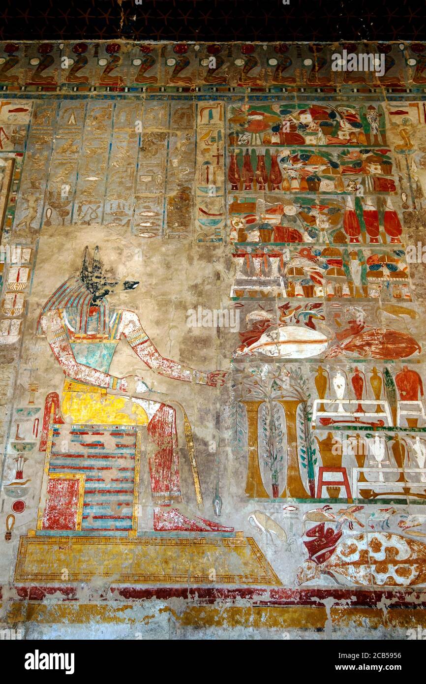 A hieroglyph with original paint work depicting Anubis the canine god of the dead at the Temple of Hatshepsut at Deir al-Bahri near Luxor in Egypt. Stock Photo