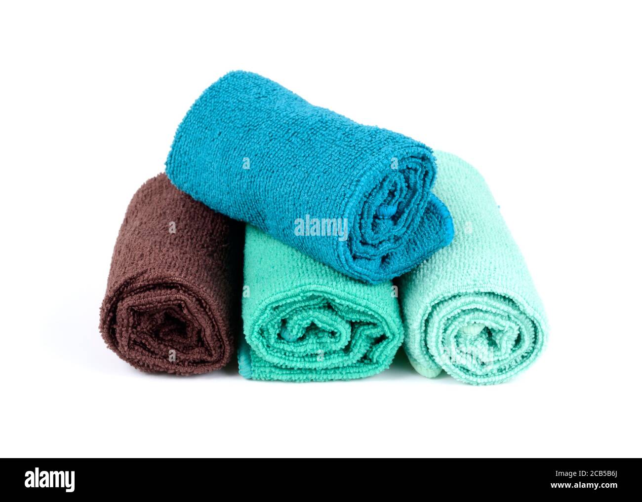Rolled clean soft towels on white background Stock Photo
