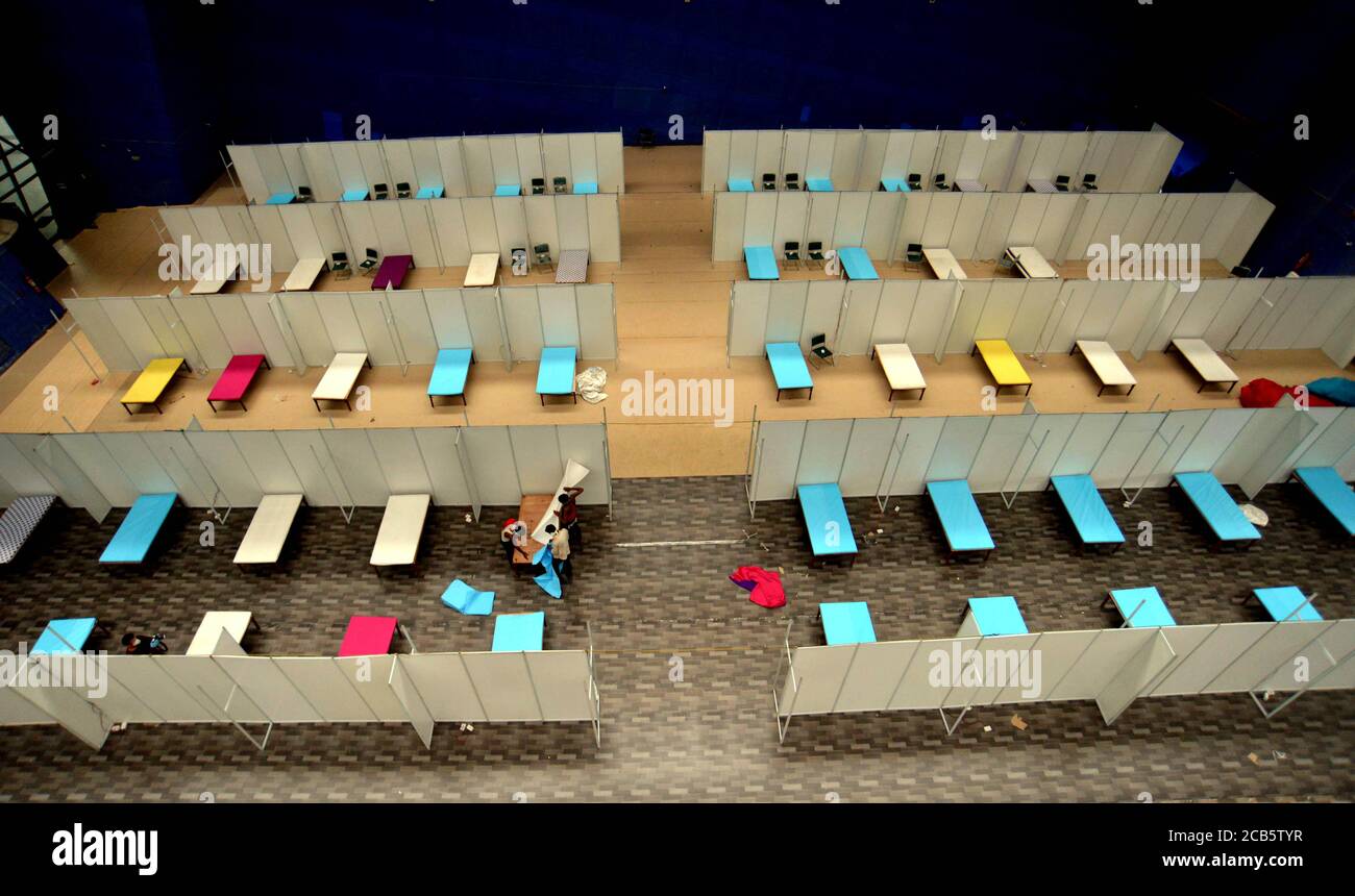 Beijing, India. 30th June, 2020. Workers set up a care center converted from an indoor stadium as the numbers of COVID-19 cases rise in New Delhi, India, June 30, 2020. Credit: Partha Sarkar/Xinhua/Alamy Live News Stock Photo