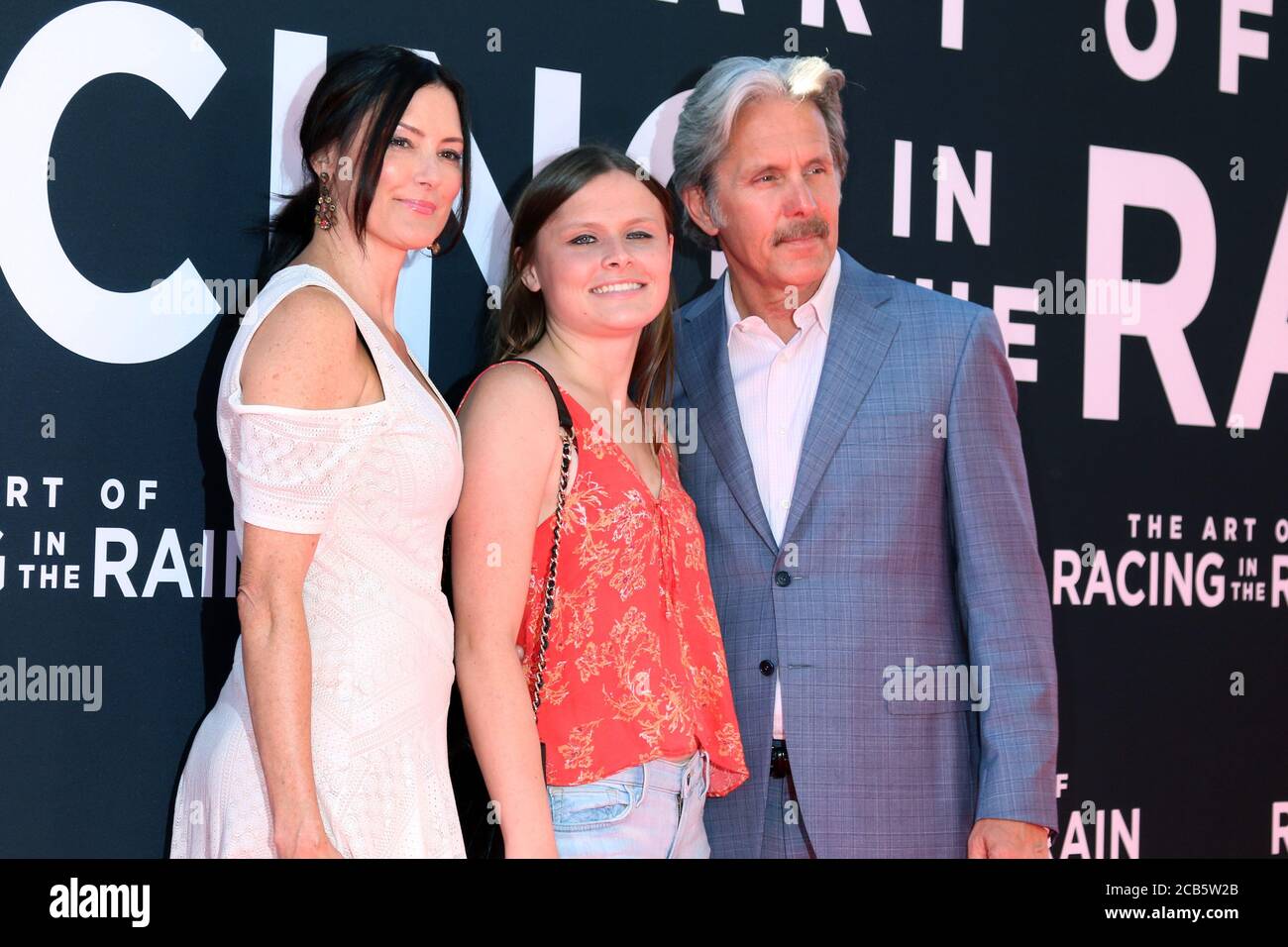 LOS ANGELES - AUG 1:  Guest, Mary Cole, Gary Cole at the 'The Art of Racing in the Rain' World Premiere at the El Capitan Theater on August 1, 2019 in Los Angeles, CA Stock Photo